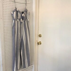 Capri jumpsuit. Navy and white stripes. Adjustable spaghetti straps.